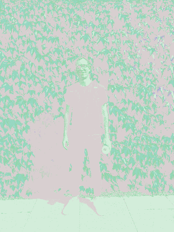 A photo of me standing in front of some leaves.